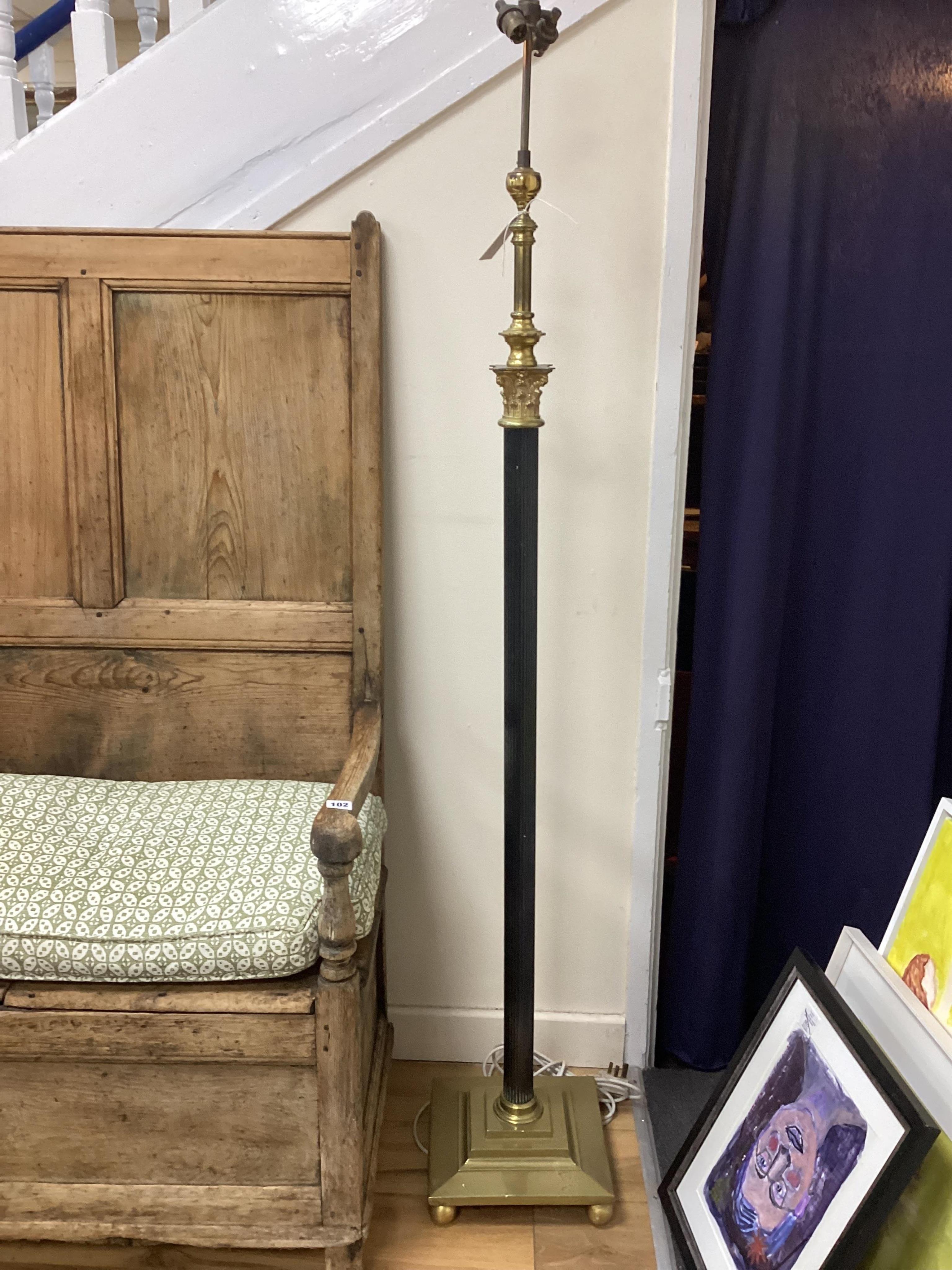 An Edwardian brass Corinthian column telescopic standard lamp. Condition - good